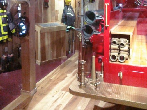 Museum room with rustic floors, beams, etc.