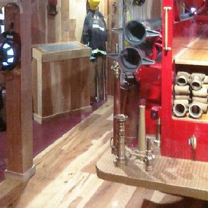 Museum room with rustic floors, beams, etc.